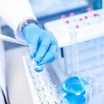 filling test tubes with blue liquid