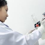 scientist using medical instrument