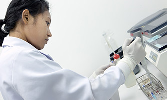 scientist using medical instrument